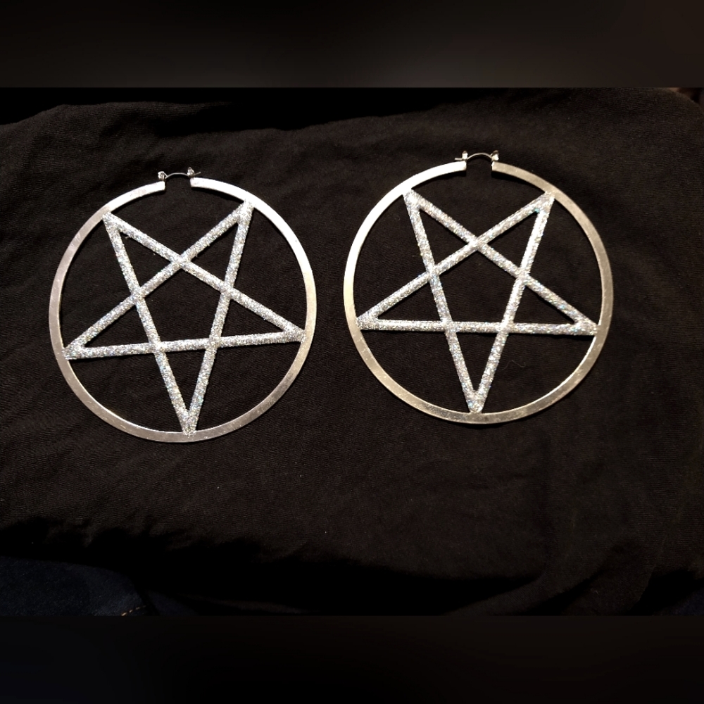 Silver colored pentagram earrings
